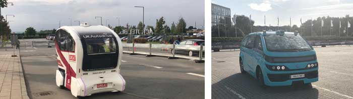 様々な自動運転車両がデモ走行する会場内（左：イギリスのPathfinder、右：フランスのNavya社のAutonom Cab）...ザ・トラック